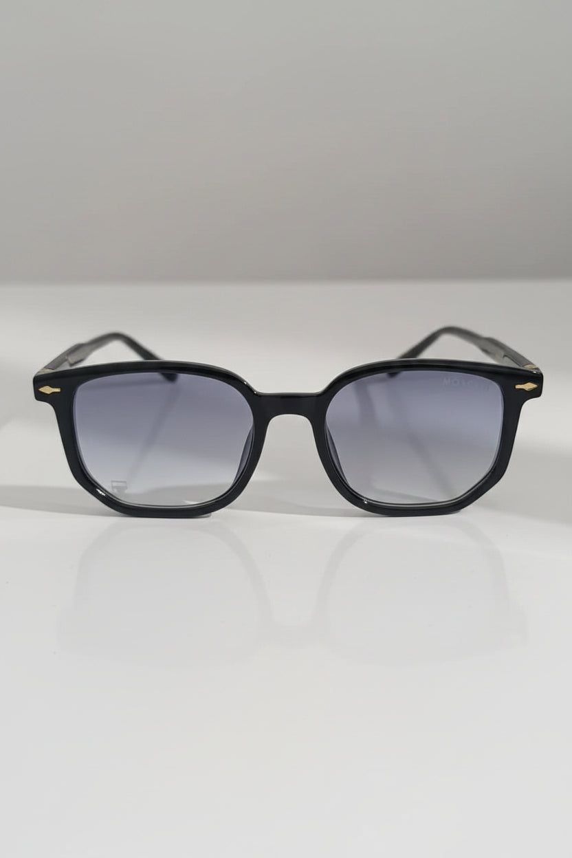 Black sunglasses with gradient lenses on a white surface