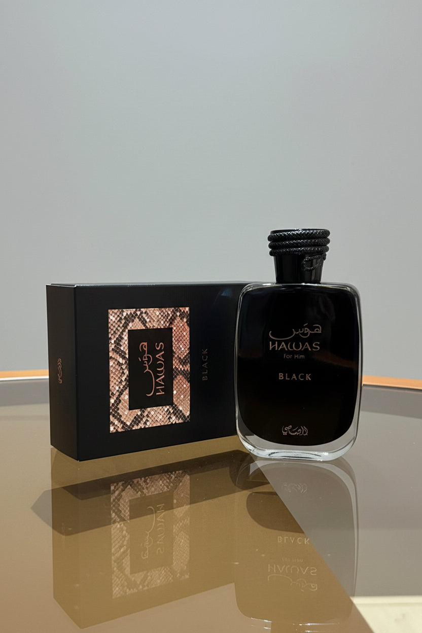 Perfume bottle and packaging with 'Haldar' branding on a reflective surface.