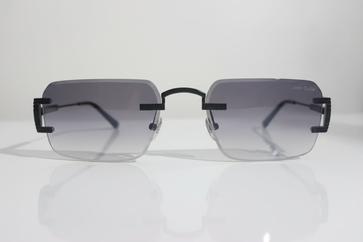 Sunglasses with black frame and clear lenses on a white surface